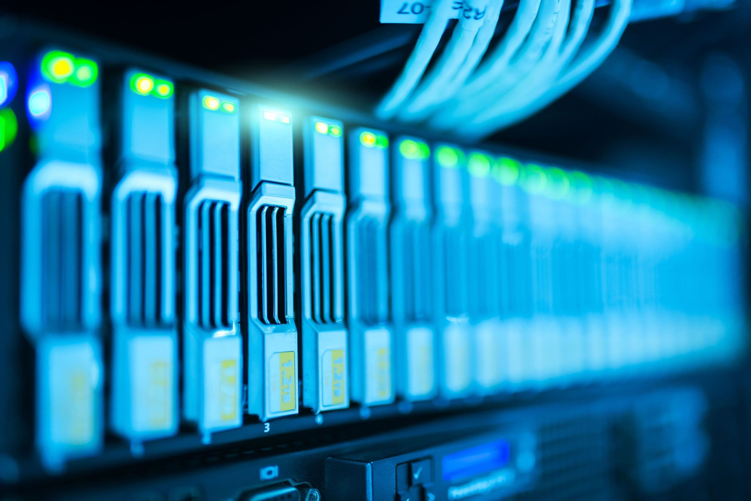IT technician configuring a network switch in the server rack of a small office